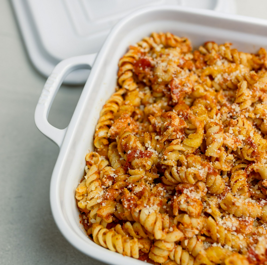 A Family Favorite Feast: Chicken Parmesan with Macaroni and Cheese, Sweet Potato Casserole, and Peach Cobbler